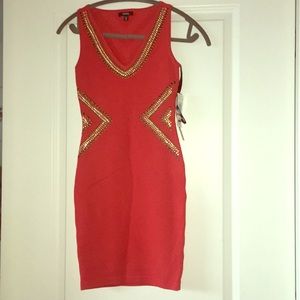 Sleeveless orange embellished dress. Never worn.